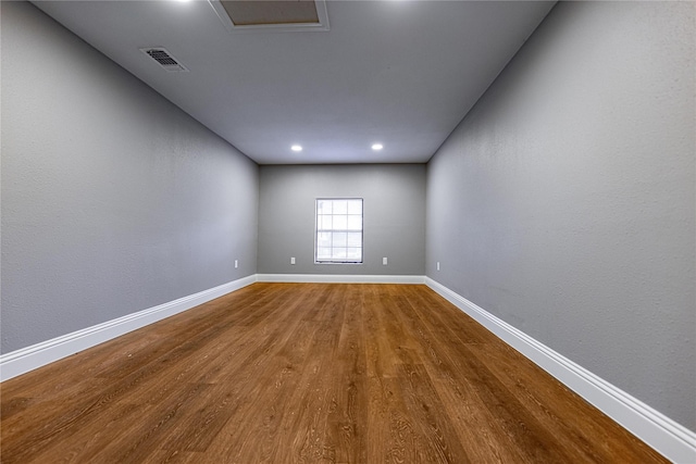3143 Grayson Dr, Dallas, TX 75224 - unfurnished room featuring wood finished floors, baseboards, and recessed lighting