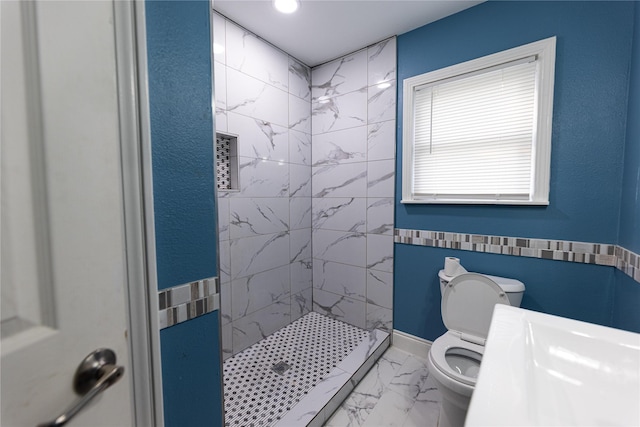 3143 Grayson Dr, Dallas, TX 75224 - bathroom featuring toilet, marble look tiles, and a tile shower
