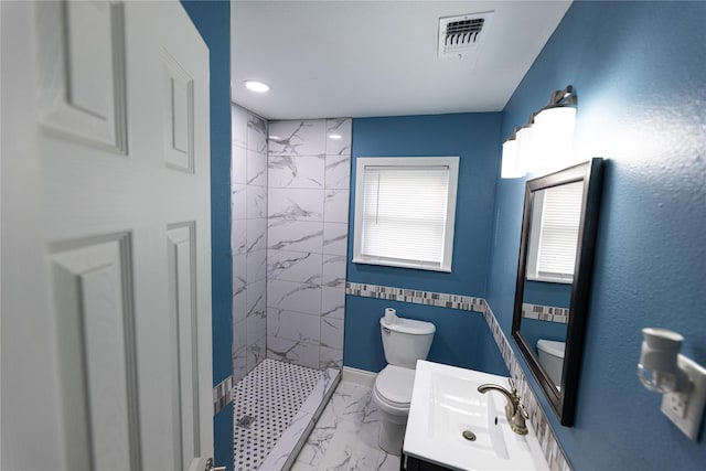 3143 Grayson Dr, Dallas, TX 75224 - bathroom with toilet, marble look tiles, a tile shower, vanity, and baseboards