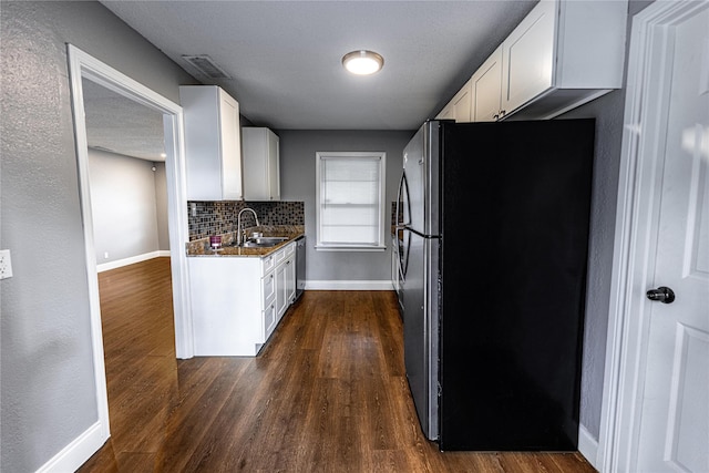 3143 Grayson Dr, Dallas, TX 75224 - kitchen featuring appliances with stainless steel finishes, a sink, baseboards, and dark wood-style floors