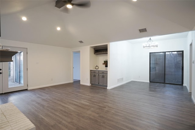 unfurnished living room with lofted ceiling, visible vents, and ceiling fan with notable chandelier