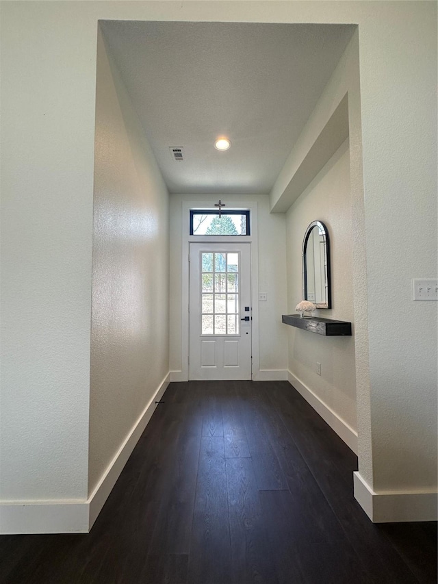186 Vista Dr, Eustace, TX 75124 - doorway to outside featuring baseboards, visible vents, and dark wood-style floors