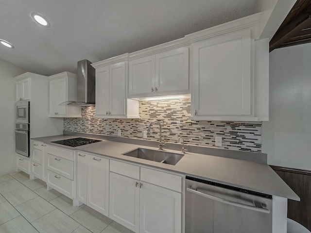907 Red Oak Creek Dr, Ovilla, TX 75154 - kitchen featuring wall chimney range hood, appliances with stainless steel finishes, a sink, white cabinetry, and recessed lighting
