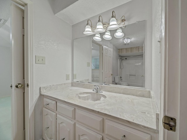 907 Red Oak Creek Dr, Ovilla, TX 75154 - full bathroom featuring vanity, a textured ceiling, a shower, and toilet