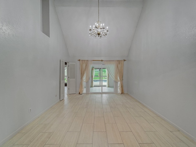907 Red Oak Creek Dr, Ovilla, TX 75154 - spare room featuring high vaulted ceiling, a chandelier, and baseboards