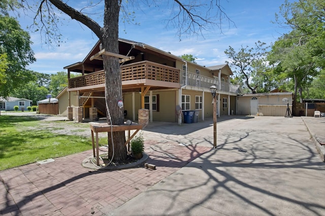 1919 Muncie Ave, Dallas, TX 75212 - back of house with a lawn and a patio