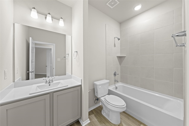 473 Silent Pond Park, Lavon, TX 75166 - bathroom featuring toilet, visible vents, shower / bath combination, wood finished floors, and vanity