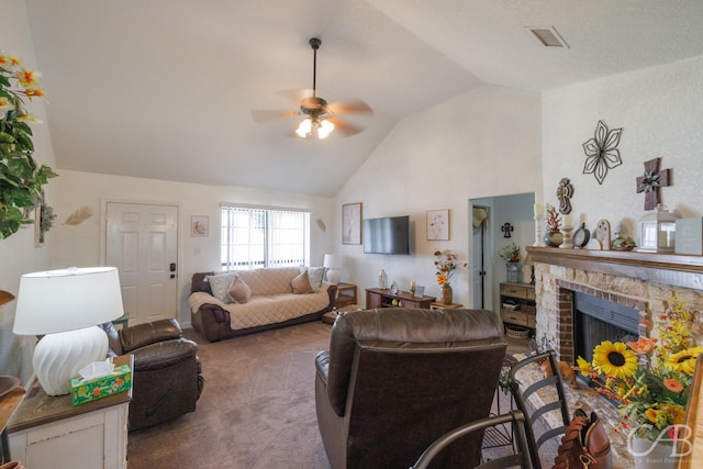 living area featuring visible vents, a fireplace, carpet flooring, high vaulted ceiling, and ceiling fan