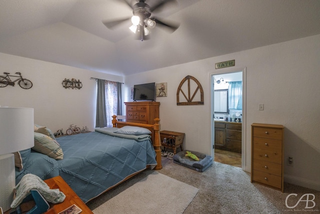 bedroom featuring ensuite bath, a ceiling fan, and carpet