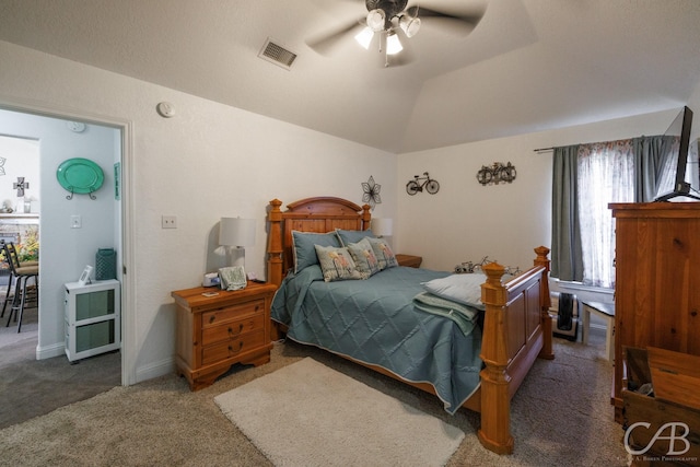 bedroom featuring vaulted ceiling, visible vents, carpet floors, and a ceiling fan