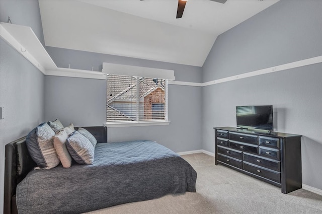 carpeted bedroom featuring ceiling fan, lofted ceiling, and baseboards