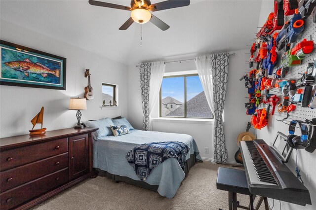 bedroom featuring vaulted ceiling, carpet flooring, and ceiling fan