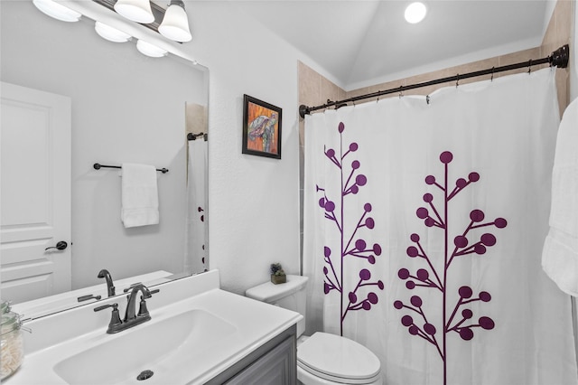 bathroom with a shower with shower curtain, lofted ceiling, toilet, and vanity