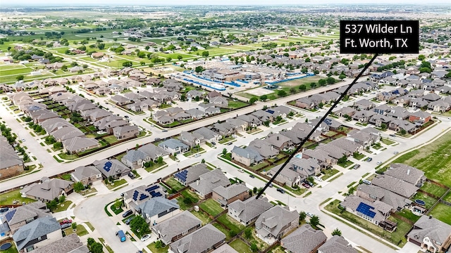 birds eye view of property with a residential view