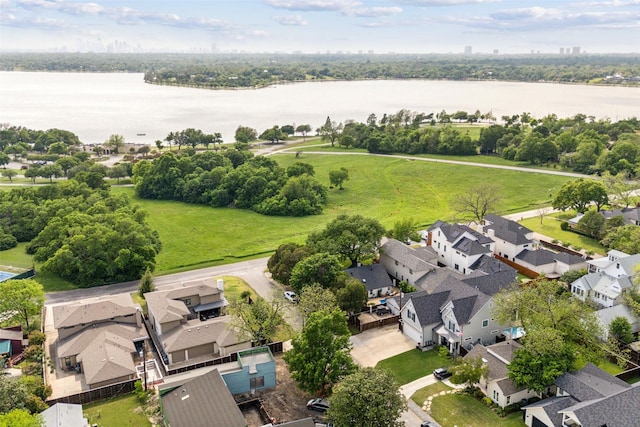 birds eye view of property with a residential view and a water view