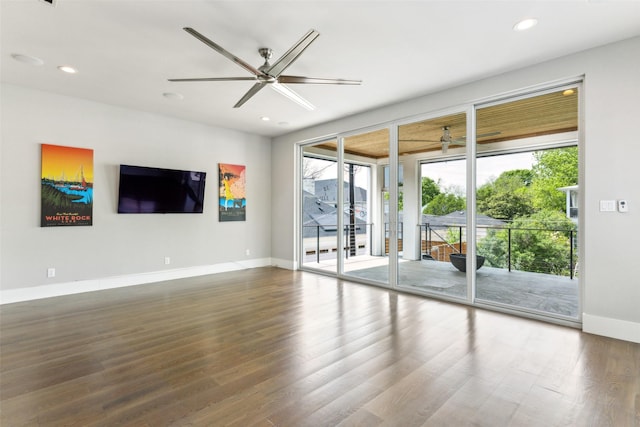 unfurnished living room with recessed lighting, wood finished floors, baseboards, and ceiling fan