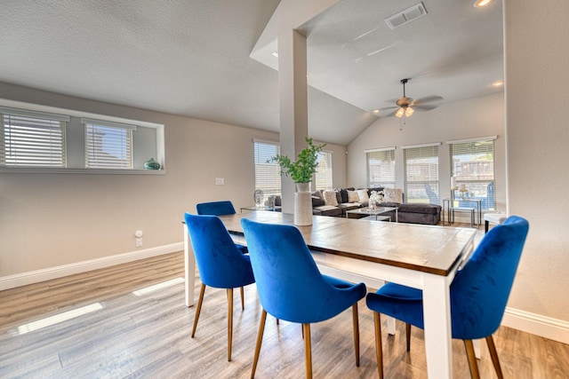 1023 Clydeview Rd, Forney, TX 75126 - dining area with lofted ceiling, wood finished floors, visible vents, baseboards, and ceiling fan