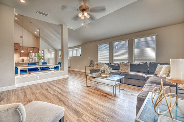 1023 Clydeview Rd, Forney, TX 75126 - living area with light wood-type flooring, vaulted ceiling, baseboards, visible vents, and ceiling fan