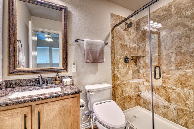 1023 Clydeview Rd, Forney, TX 75126 - bathroom featuring a textured wall, vanity, a shower stall, and toilet