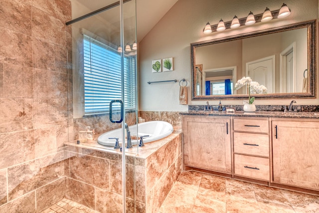 1023 Clydeview Rd, Forney, TX 75126 - bathroom with a tile shower, lofted ceiling, double vanity, a sink, and a bath