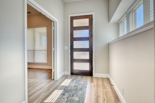 1023 Clydeview Rd, Forney, TX 75126 - foyer entrance with baseboards, a wealth of natural light, visible vents, and light wood-type flooring