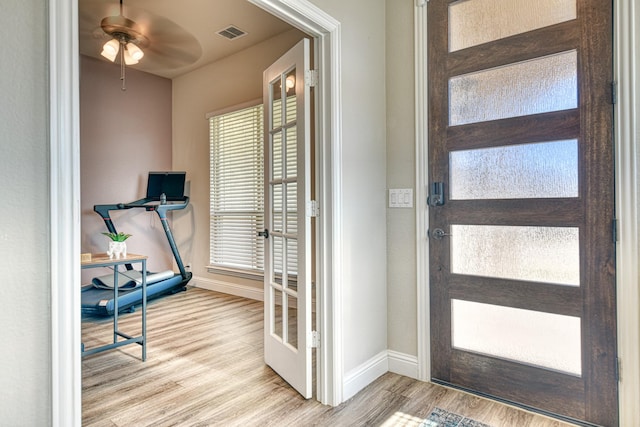 1023 Clydeview Rd, Forney, TX 75126 - foyer with ceiling fan, baseboards, wood finished floors, and visible vents