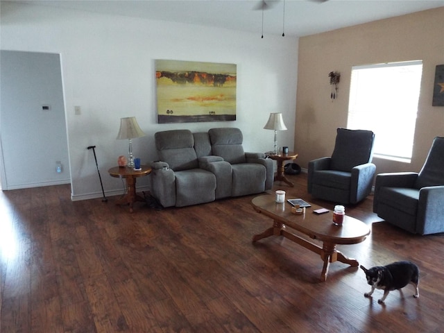 living room with wood finished floors and ceiling fan