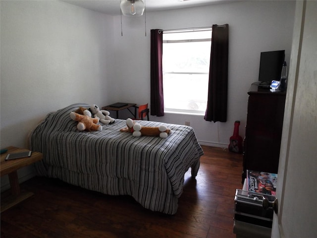 bedroom featuring wood finished floors