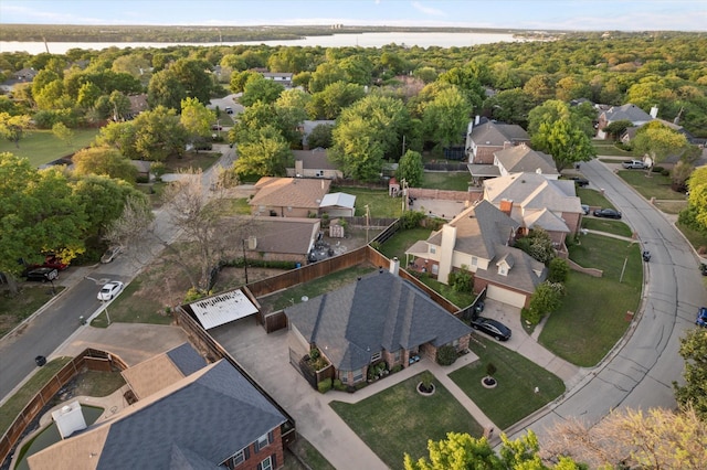 bird's eye view featuring a residential view and a water view