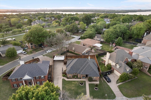 drone / aerial view with a residential view and a water view