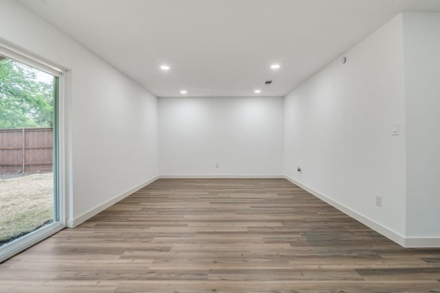 237 Trailridge Dr, Garland, TX 75043 - unfurnished room featuring recessed lighting, wood finished floors, and baseboards