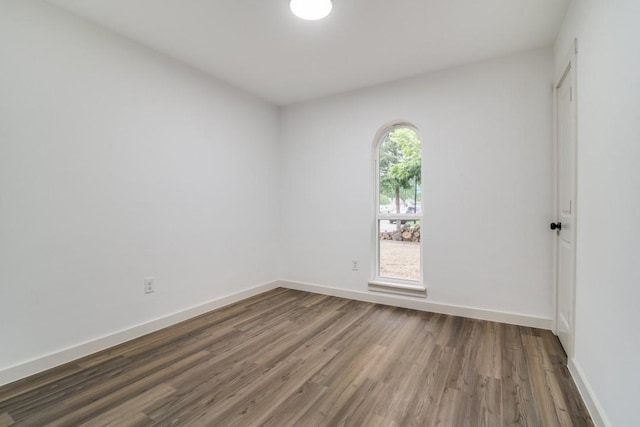 237 Trailridge Dr, Garland, TX 75043 - unfurnished room featuring baseboards and wood finished floors