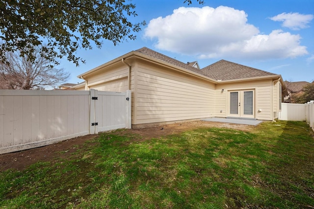 924 Charleston Ln, Savannah, TX 76227 - back of property featuring a gate, a fenced backyard, an attached garage, french doors, and a lawn
