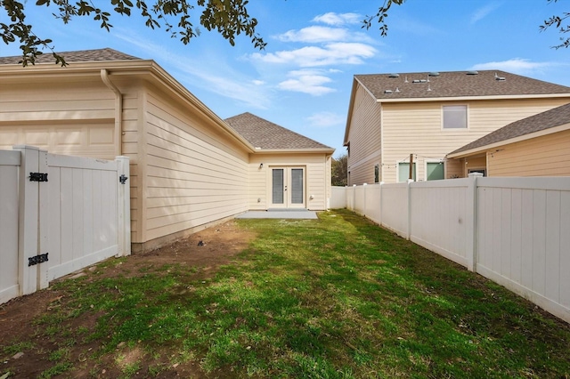 924 Charleston Ln, Savannah, TX 76227 - rear view of property with a fenced backyard, a gate, a yard, and french doors