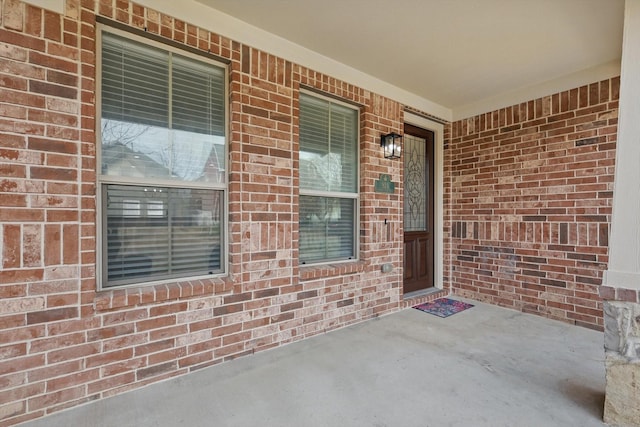 924 Charleston Ln, Savannah, TX 76227 - doorway to property with brick siding and covered porch