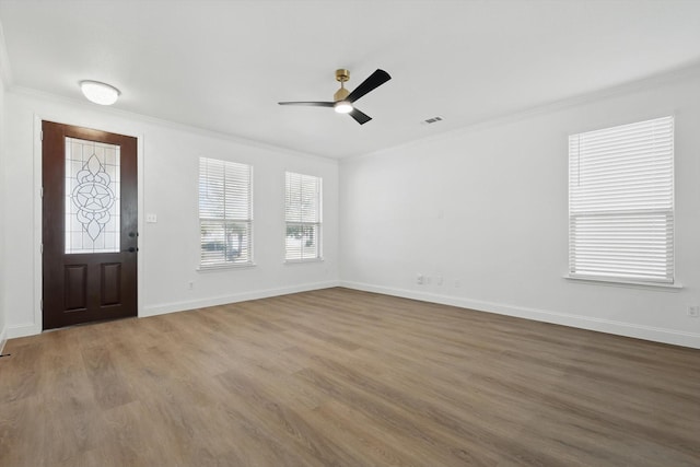 924 Charleston Ln, Savannah, TX 76227 - foyer featuring wood finished floors, visible vents, crown molding, and baseboards
