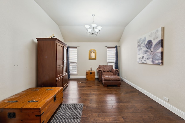 living area featuring vaulted ceiling, baseboards, a notable chandelier, and dark wood-style flooring