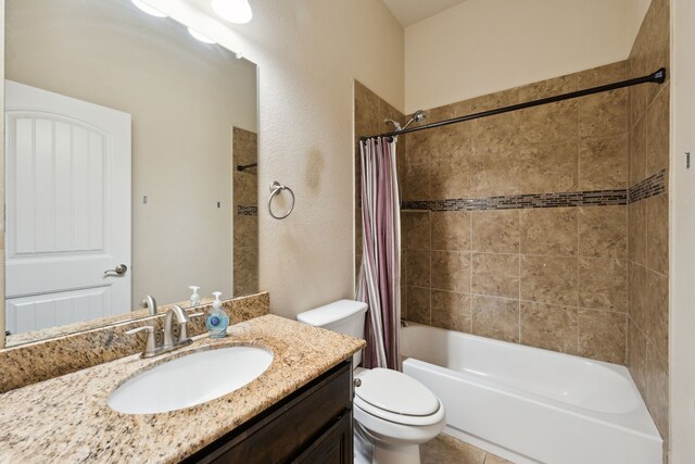 full bath with shower / bath combo, toilet, and vanity