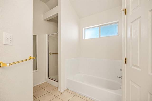 full bath featuring tile patterned floors, a shower stall, baseboards, and a garden tub