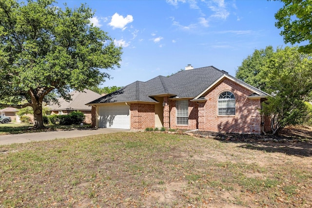 ranch-style home featuring a front yard, roof with shingles, brick siding, concrete driveway, and an attached garage