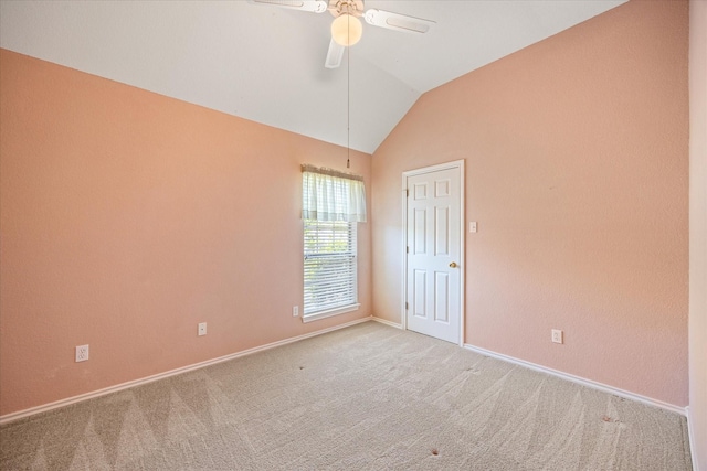 unfurnished room featuring baseboards, carpet flooring, a ceiling fan, and vaulted ceiling