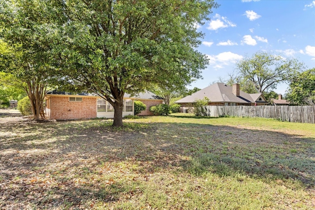 view of yard with fence