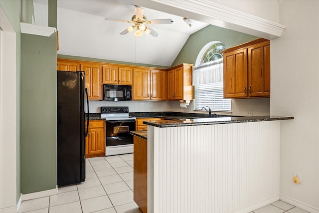 kitchen with a peninsula, a ceiling fan, light tile patterned floors, black appliances, and vaulted ceiling