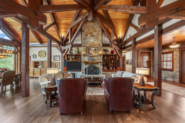 living room with beamed ceiling, wood finished floors, wood ceiling, and a notable chandelier