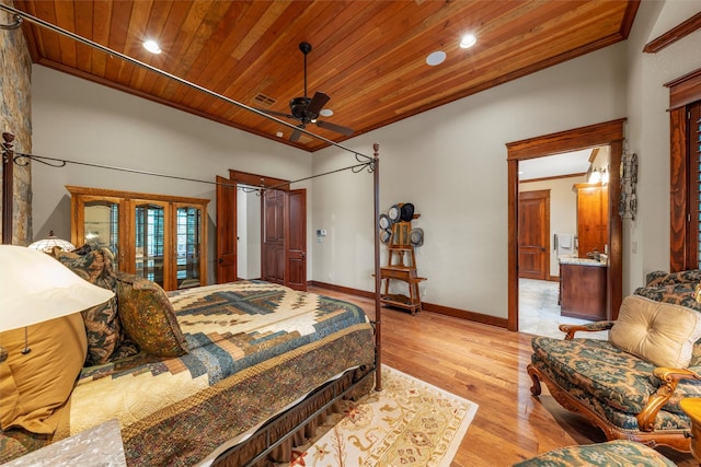 bedroom featuring crown molding, wood ceiling, and access to outside