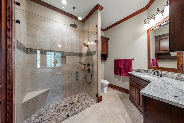 full bath featuring toilet, baseboards, a shower stall, crown molding, and vanity