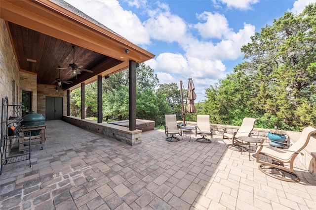 view of patio featuring a covered hot tub and ceiling fan