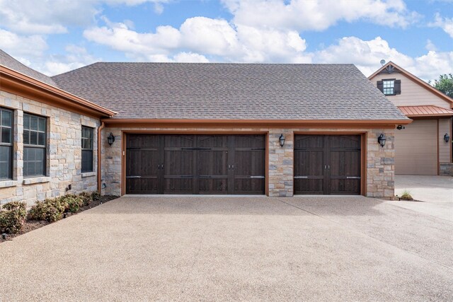garage featuring driveway