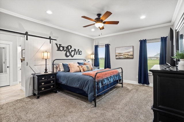 bedroom featuring crown molding, a barn door, and recessed lighting