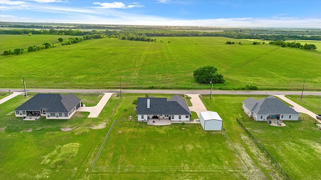 birds eye view of property featuring a rural view
